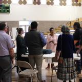 Rebecca Touchin, Tribal Liaison and Constituent Services Representative, chats with tribal education leaders.