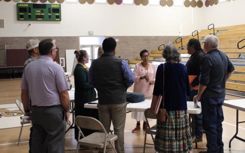 Rebecca Touchin, Tribal Liaison and Constituent Services Representative, chats with tribal education leaders.
